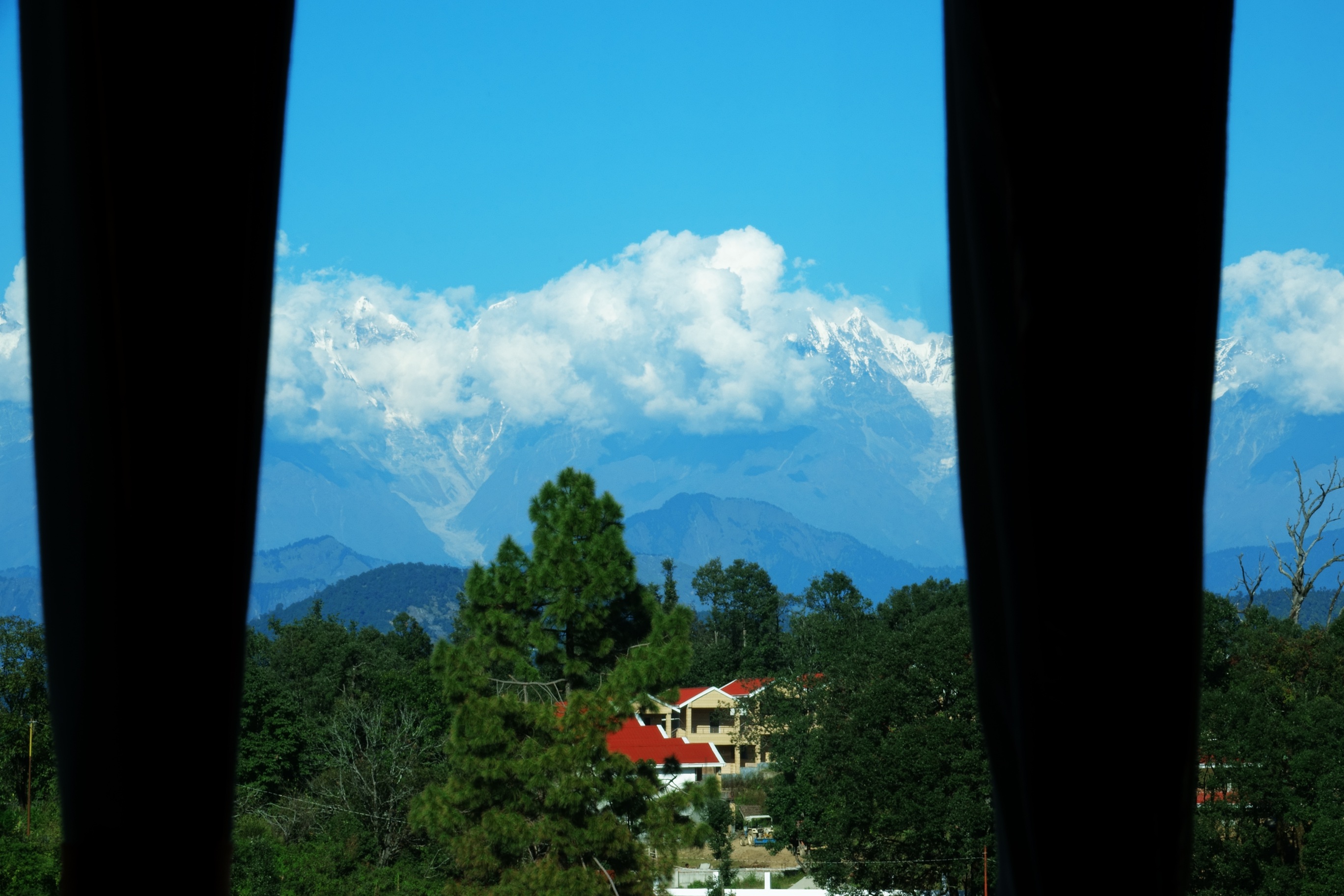 Luxury gallery of Ojaswi Himalayan Resort Mukteshwar, showcasing rooms, weddings, and scenic mountain views.