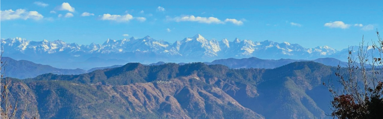 Panoramic snow-capped Himalayan mountain range view from Mukteshwar Uttarakhand