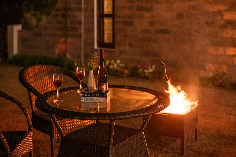 A scenic table for two with a direct view of the snow-capped mountains at Ojaswi Himalayan Resort’s premium restaurant.