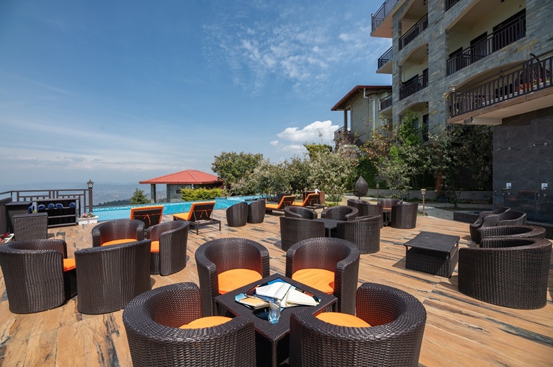 Authentic Kumaoni cuisine and local Pahadi flavors prepared by expert chefs at Ojaswi Himalayan Resort.