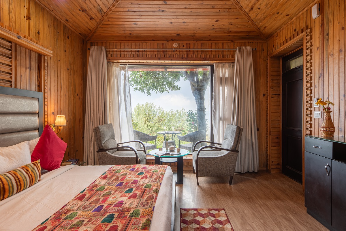 Jungle Retreat at Ojaswi Resort Mukteshwar - Luxury rustic cottage with British-inspired architecture and mountain views.