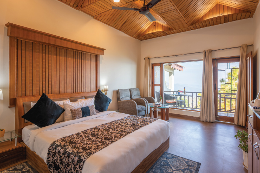 Terrace Room at Ojaswi Resort Mukteshwar, ideal for families and group travelers with spacious layout and mountain views.